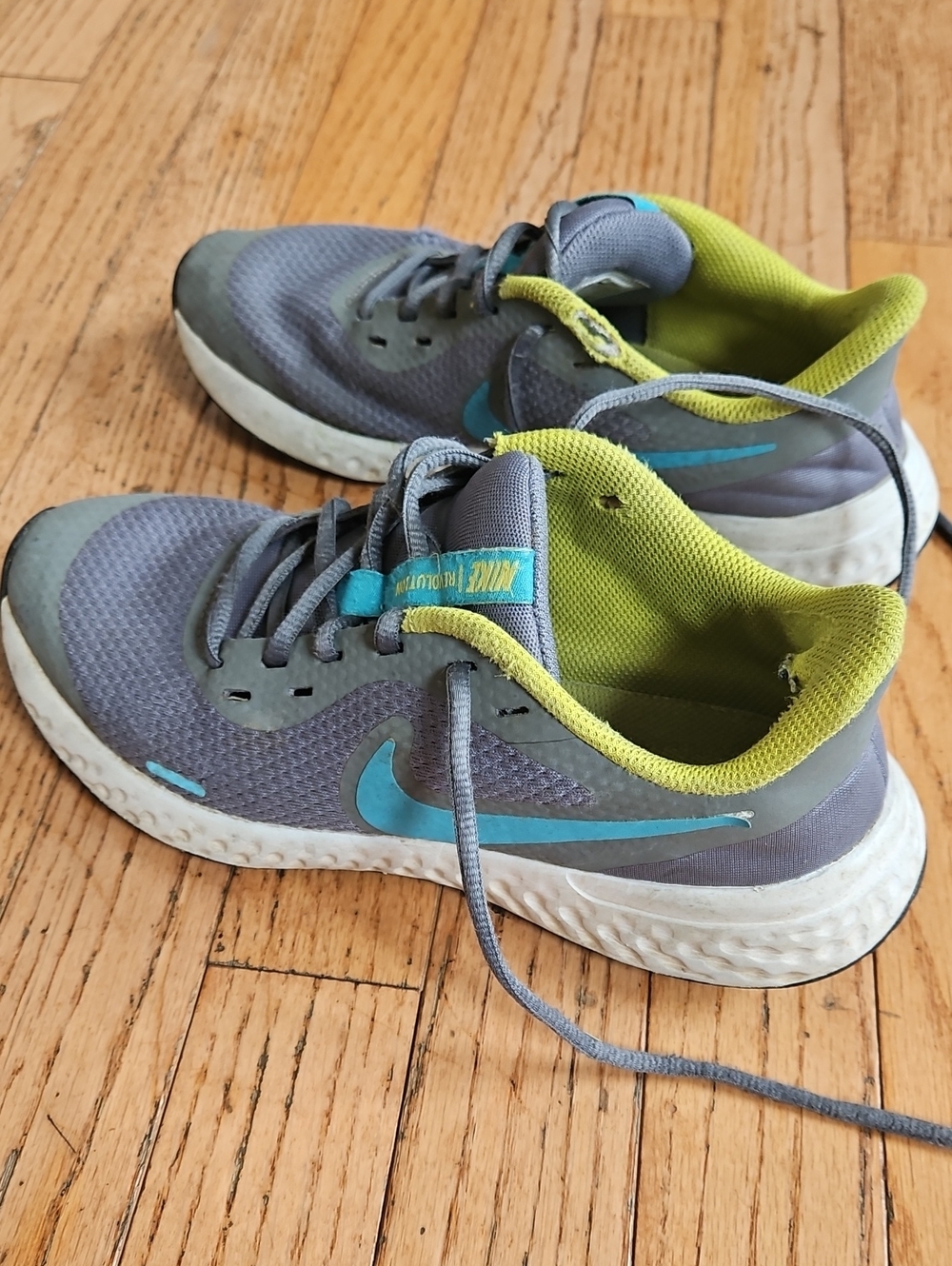 Nike Grey Shoes with Teal Swoosh and Lime Green Lining